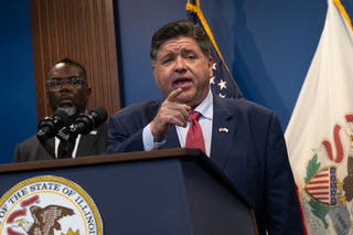 Illinois Governor JB Pritzker speaks to the press on Tuesday in Chicago